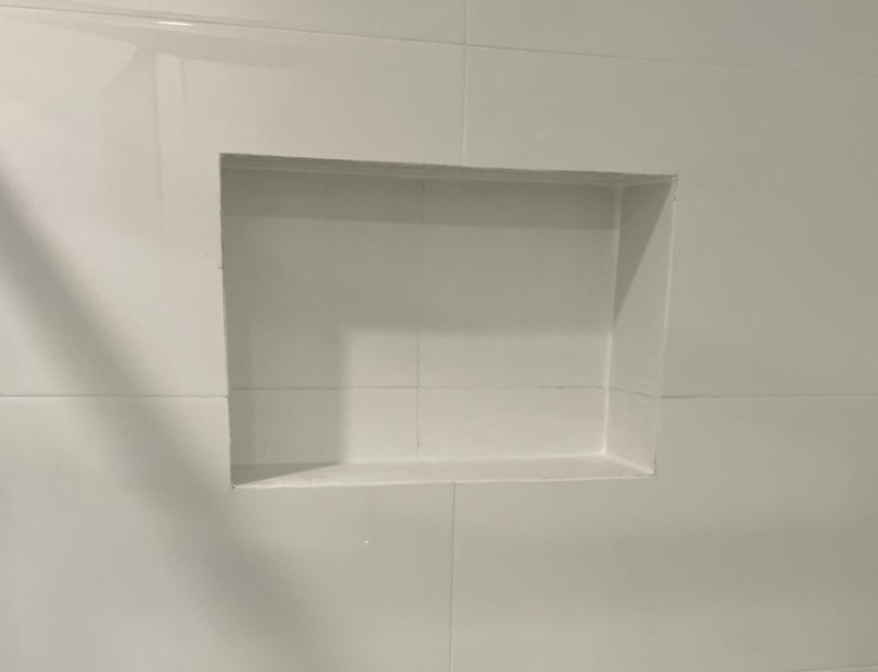 JSBL Group Tile and Grout Repair About Page Image A photo of JSBL Group's Tile and Grout repair in a shower recess